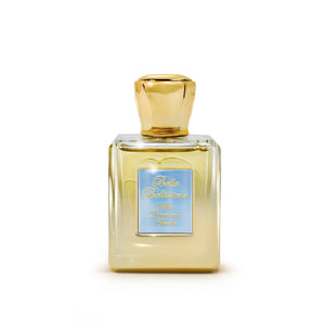 Blue Diamond Absolue perfume extrait, presented in a golden shaded bespoke glass bottle with a gold cap and a pale blue engraved plaque, infilled with gold text.