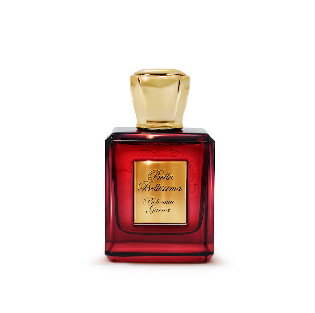 Bohemia Garnet oud parfum by Bella Bellissima, presented in a deep red glass bottle with gold cap and engraved plaque.